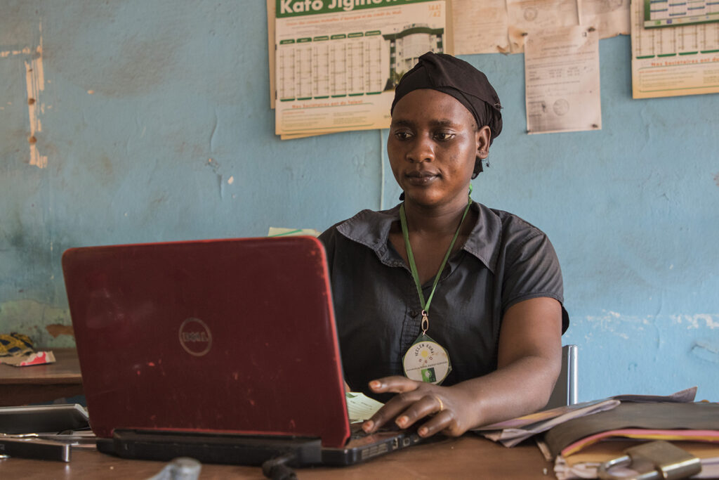 Woman behind laptop in office
