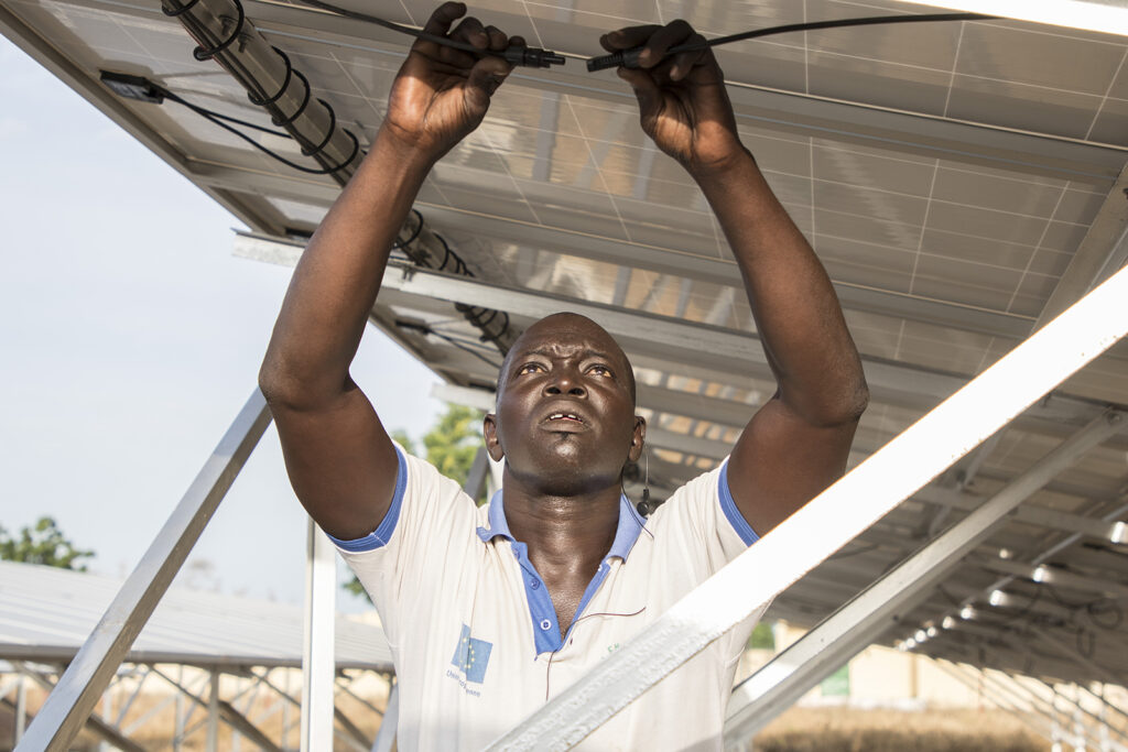 Connection electricity solar panels by technician